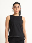 Organic Black cotton Closed neck sleeveless top with white piping detailing at the hem line.
