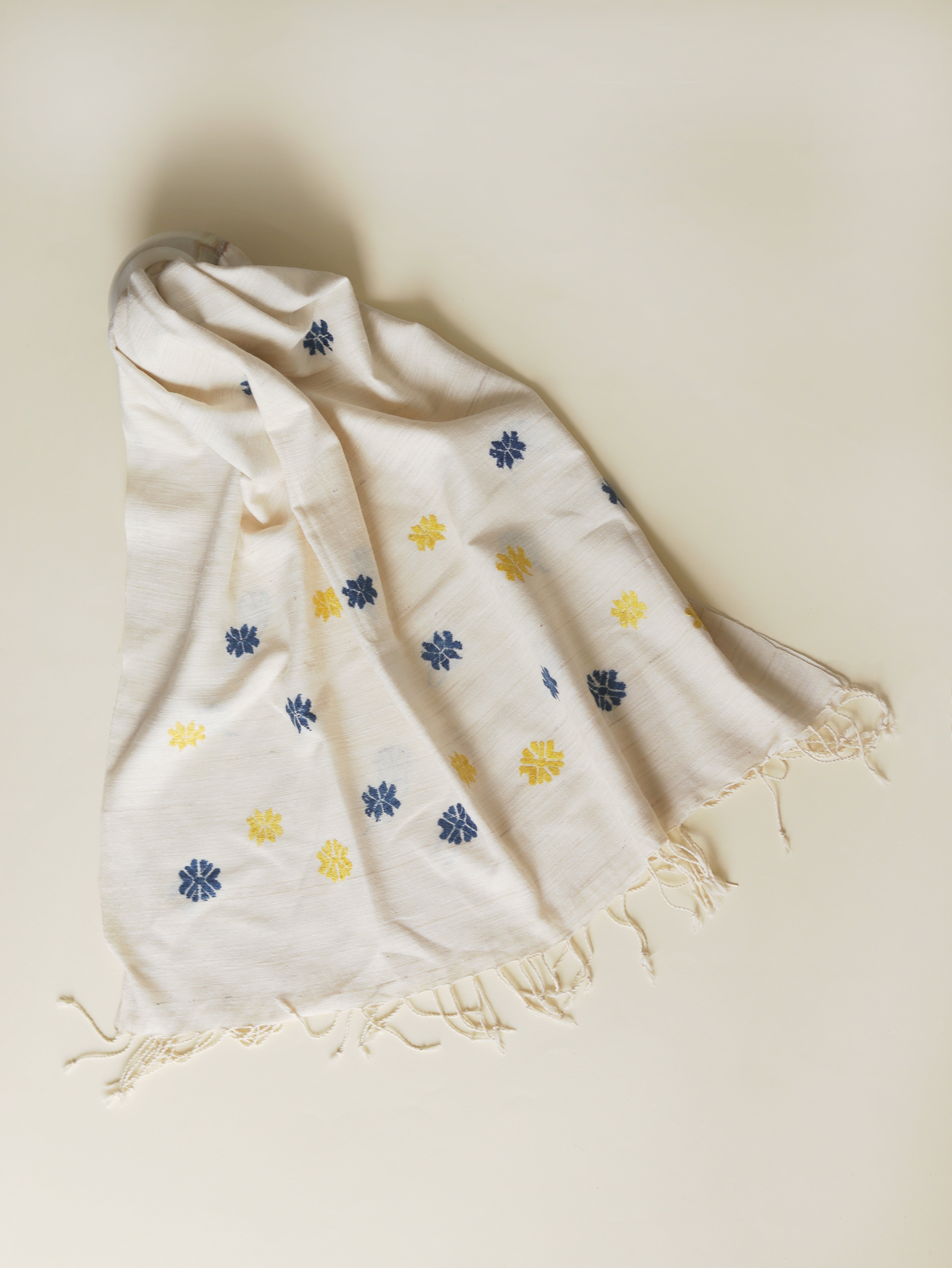 White scarf with blue & yellow motifs